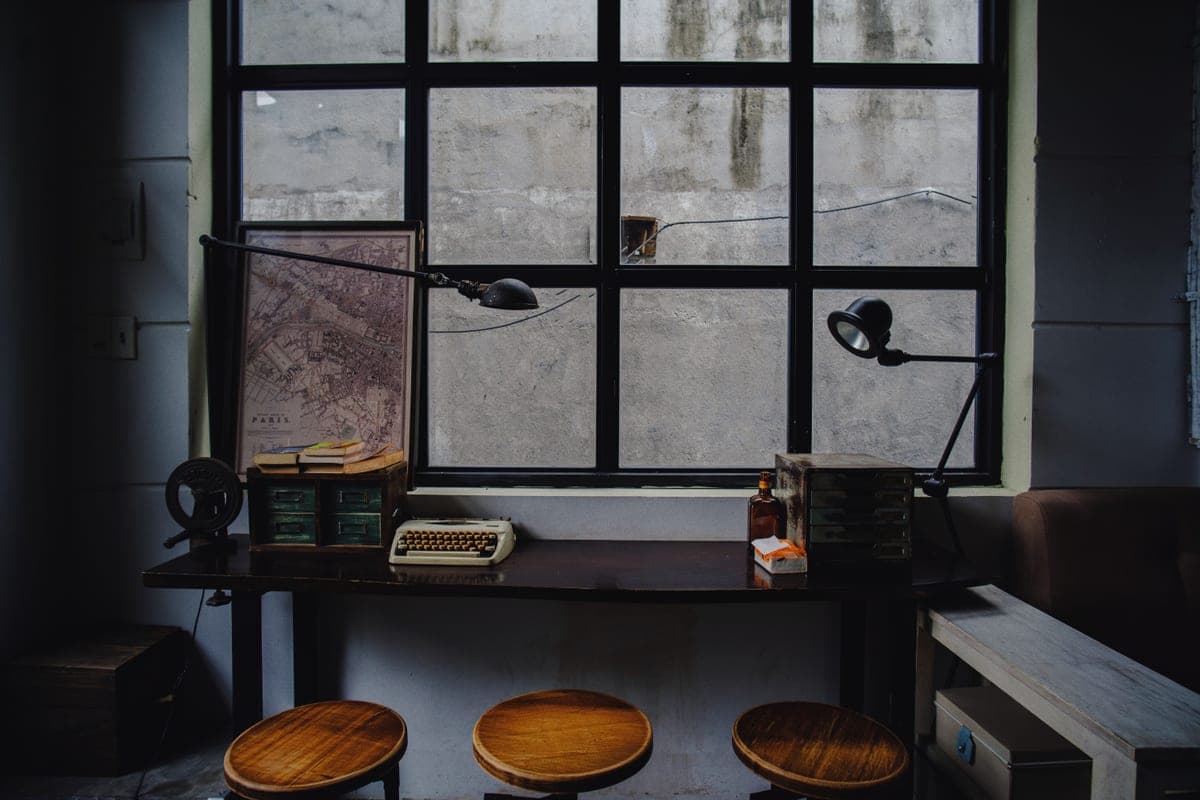 A quiet writing desk beside a window