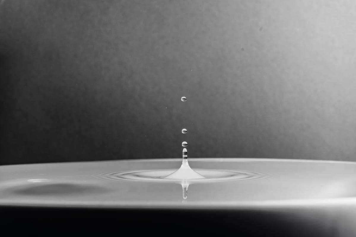 A water drop in a small cup