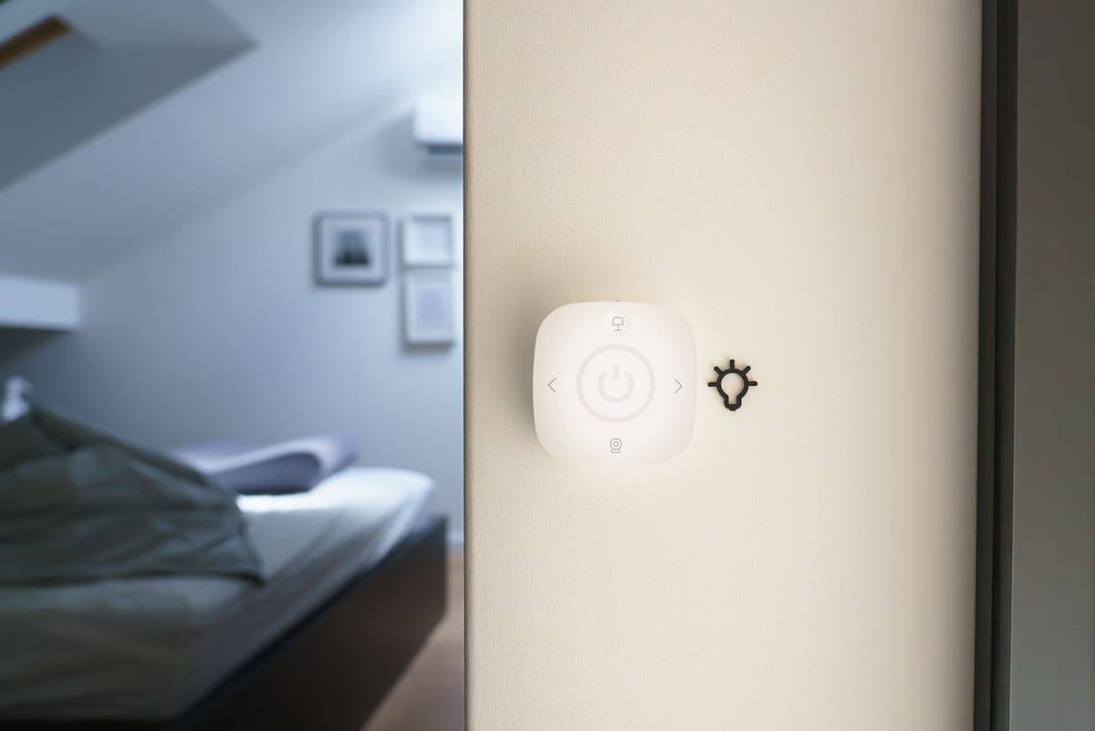 A smart camera device mounted on a wall