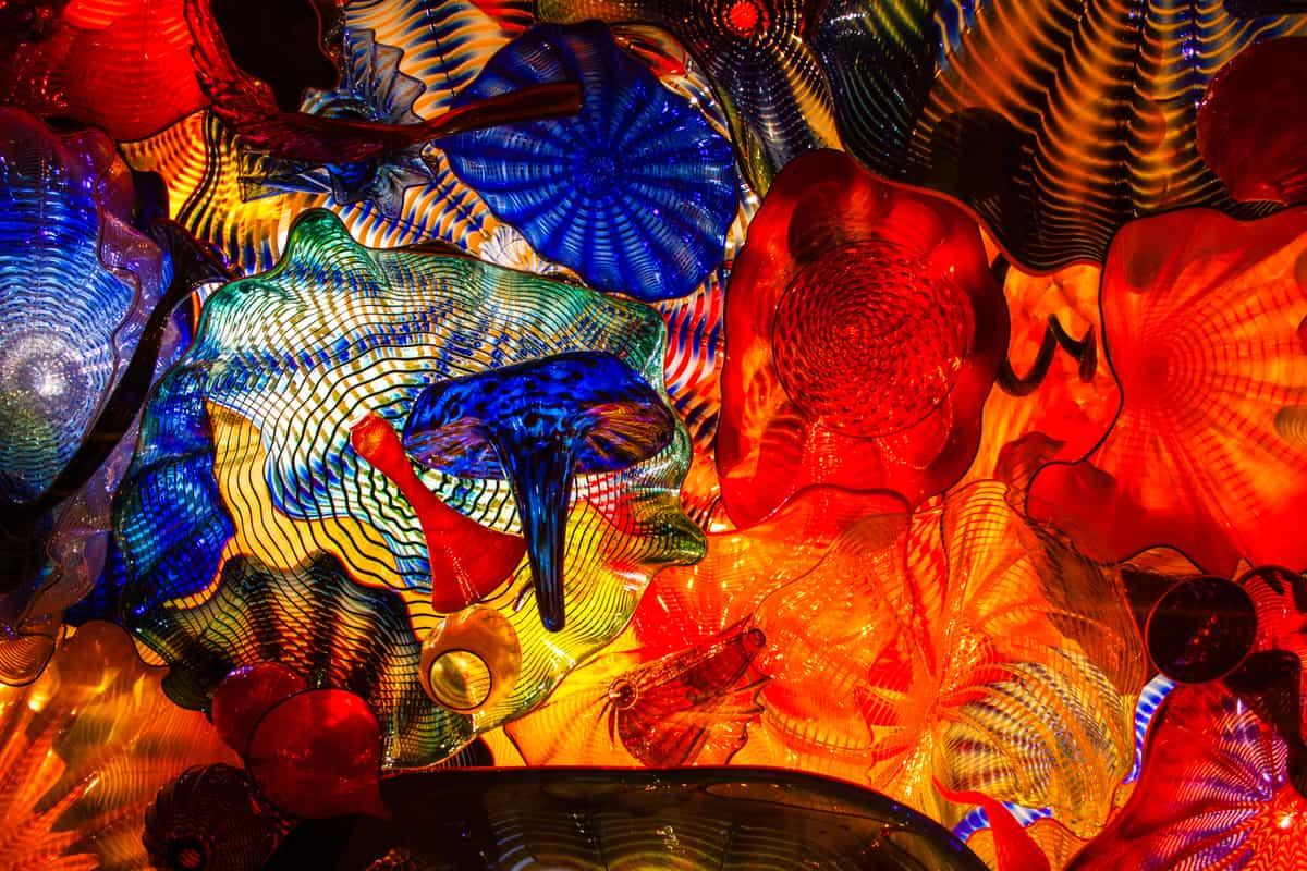 A hand-blown colored glass ornament catching light