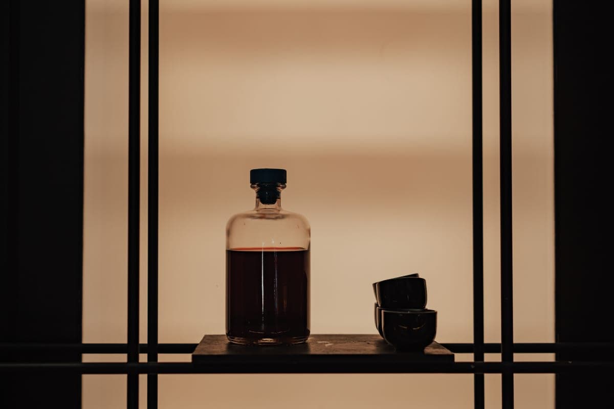 Red liquid in a bottle on a shelf